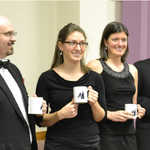 Guest artists with their anniversary mugs at the reception