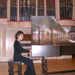 Alejandra with the harpsichord at the University of S.Carolina. Painting is of the early days of the university. 