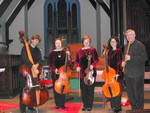 Jeff Ferdon with violone (unknown original - English?), Karen holding Holly's bass viol by Zuchowicz (Ottawa, Ontario), Holly with treble by Zuchowicz, Rebecca with Jeff's bass viol by John Pringle (N. Carolina), Eddie with flauto traverso by Prescott (Mass.), in background harpsichord by Willard Martin after Mersenne