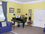 St. Matthew house parlor complete with piano