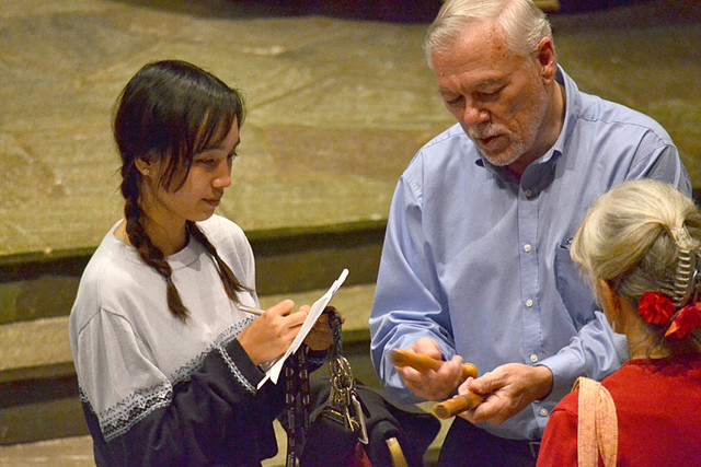 Eddie shares instruments with a student after the concert.