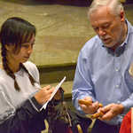 Eddie shares instruments with a student after the concert.